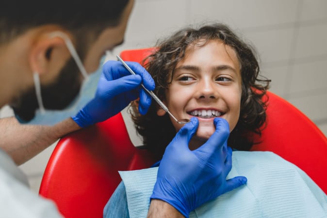 boy-visiting-dentist-stomatologist-orthodontist-c-2021-12-09-04-31-33-utc-min-2048x1366
